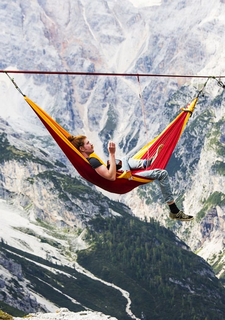 Relaxing in a sky hammock.