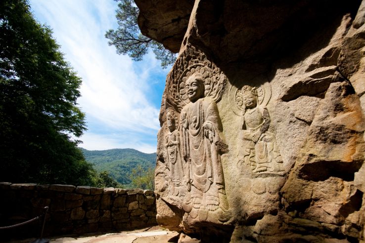 Rock carved triad Buddha Trip Packages