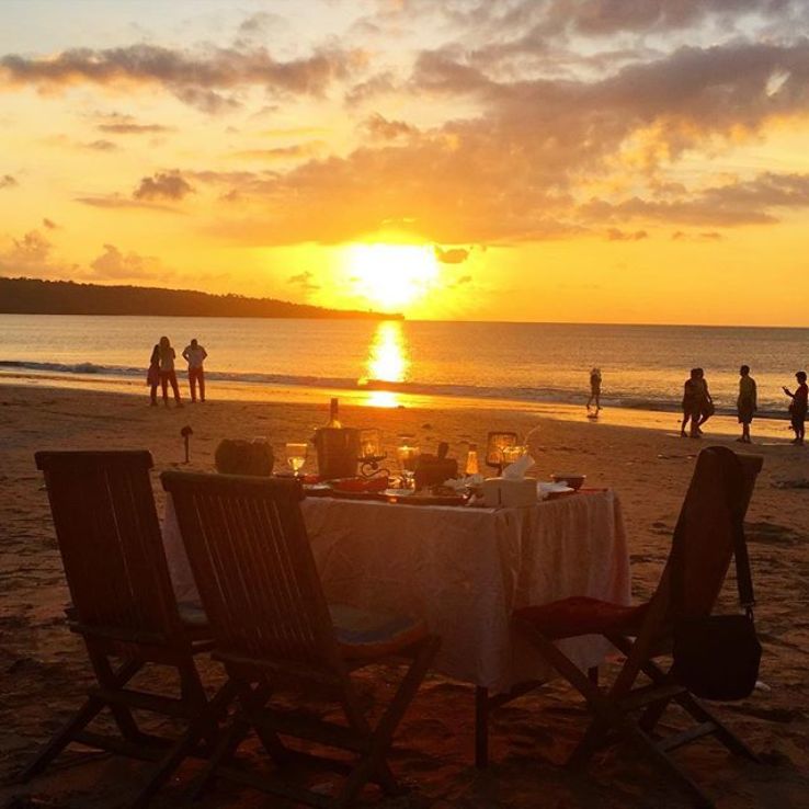 Dinner by the sunset at Jimbaran Beach  Trip Packages